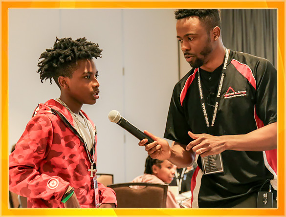 A teen is interviewed at the Youth Summit